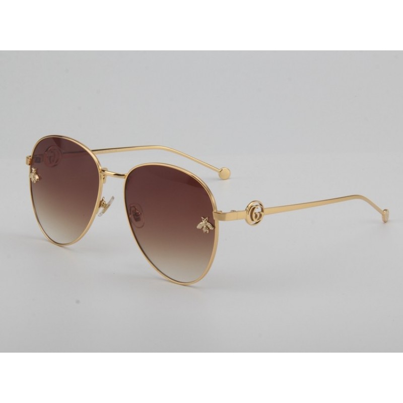 Gucci GG0398S Sunglasses In Gradient Grey Gold