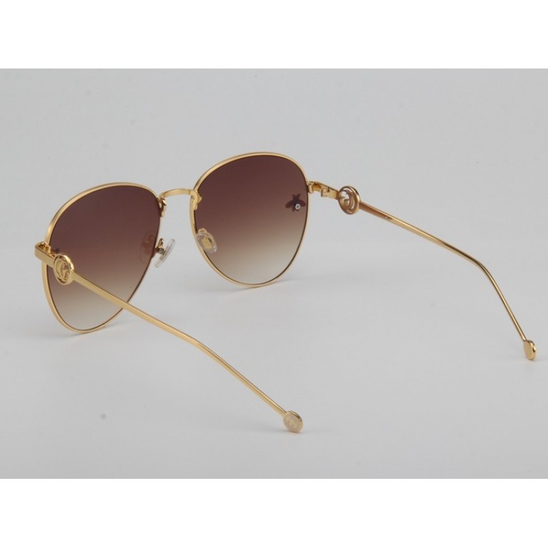 Gucci GG0398S Sunglasses In Gradient Grey Gold