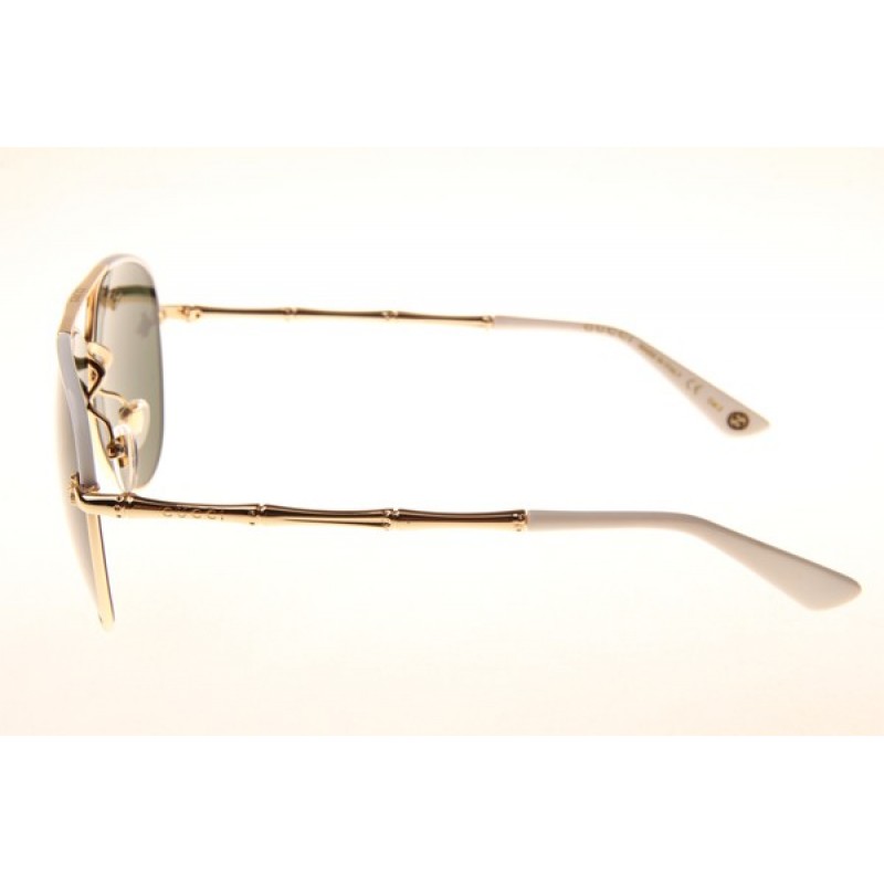 Gucci GG0338S Sunglasses In White Gold Green